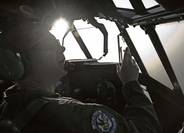 Photo by Senior Airman Jonathan StefankoCapt. Michael Trimble, 37th Airlift Squadron chief of scheduling, helps the pilot maintain visual contact with the runway during a pilot proficiency sortie March 6 above Ramstein. These types of sorties help keep more than 70 37th AS pilots proficient in various takeoff, approach and landing maneuvers.