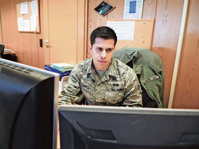 Photo by Senior Airman Brittany PerrySenior Airman Jared Flores, 86th Airlift Wing paralegal, completes his portion of the legal process at the Ramstein Law Center. Law center members strive to provide on-time, on-target legal advice and services to the KMC. 