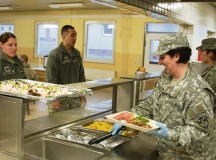 Spc. Melissa Rangle, a food service specialist assigned to the 529th Military Police Company, serves members of the 18th Military Police Brigade during their mission readiness exercise March 21.
