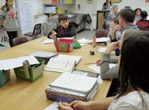 The Ramstein Middle School AVID tutoring class asks another student questions to help guide her to the answer Feb. 25.