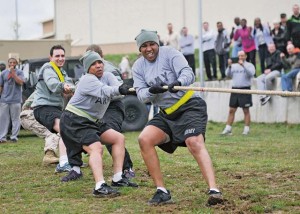 Service members from the 7th Civil Support Command’s Joint Task Force-Consequence Management participate in a tug-of-war competition during exercise Saber Guardian 14’s cultural day March 28.