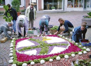 In some communities, parish members create flower  carpets for the Corpus Christi Day celebrations.