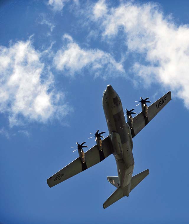 Photo by Senior Airman Christine GriffithsA U.S. Air Force C-130J Super Hercules from Ramstein performs a fly-over July 11, 2014, at Powidz Air Base, Poland. Airmen from the 86th Airlift Wing were in Poland for forward training deployments with NATO allies.