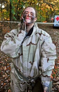Photo by Staff Sgt. Alexander BurnettStaff Sgt. Crystal S. Newman, the enlisted strength management NCO for the 21st Theater Sustainment Command personnel office, applies coal dust to her face after going through the gas chamber Oct. 31 at Breitenwald Range.
