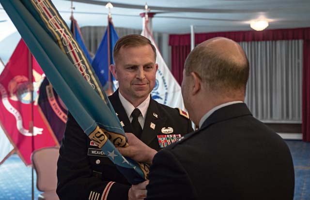 Photo by Airman 1st Class Jordan CastelanAir Force Brig. Gen. Giovanni Tuck (right), Defense Logistics Agency Energy commander, accepts the command's colors from outgoing DLA Energy Europe & Africa Commander Army Col. Robert Weaver during a change of command ceremony June 25 in Kaiserslautern.