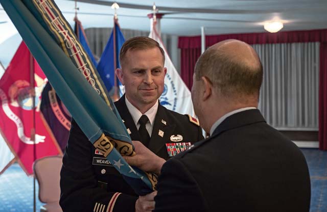 Photo by Airman 1st Class Jordan CastelanAir Force Brig. Gen. Giovanni Tuck (right), Defense Logistics Agency Energy commander, accepts the command's colors from outgoing DLA Energy Europe & Africa Commander Army Col. Robert Weaver during a change of command ceremony June 25 in Kaiserslautern. 