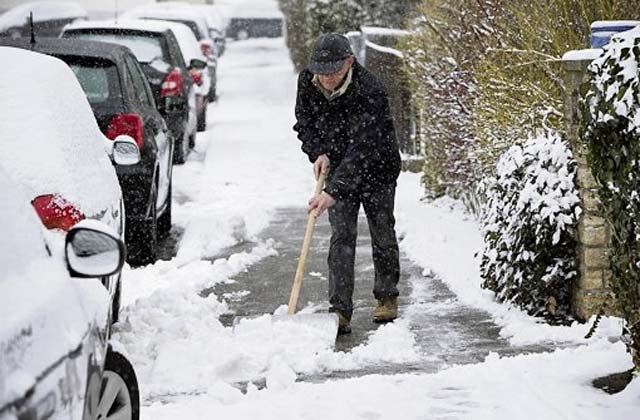 Courtesy photoOff-base residents must sweep the snow off their sidewalk.