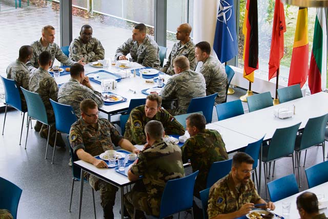 Photo by Senior Airman Armando A. Schwier-MoralesAirmen from different nations dine at the International Dining Facility Aug. 13, 2014, at the Headquarters Allied Air Command on Ramstein. In the past, an escort was required along with several days of processing time to dine at the facility. The change came after a desire to not only offer a new dining facility but also a multinational experience. 