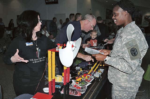 Photo by Dijon RolleSgt. Achley Lyons visits an information booth at the Army- and Air Force-sponsored Community Information Fair.