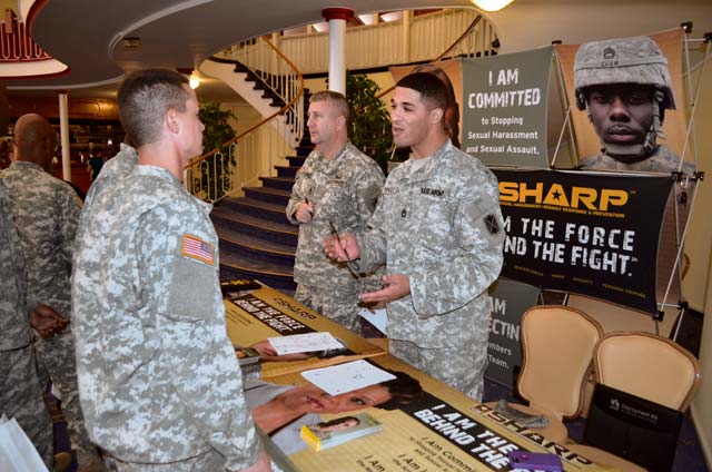 Sgts. 1st Class Stanley Quinn and Michael Browley, Sexual Assault Response Coordinators for 10th Army Air and Missile Defense Command, speak to a group of Soldiers Sept. 26 at Armstrong’s Club in Kaiserslautern. The Soldiers were participating in a readiness fair that brought together vendors, families and Soldiers to learn about the many agencies available in the KMC to help with numerous issues, including education, shopping and travel.