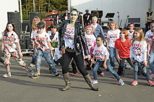 Photo by Dijon RolleCommunity members and SKIES dancers move to Michael Jackson’s “Thriller” during a  choreographed flash mob at  the closing ceremony for the Red Ribbon Run Zombie Run Oct. 19 on Sembach Kaserne in Kaiserslautern. This 5K run is an annual event   sponsored by U.S. Army Garrison Rheinland-Pfalz.