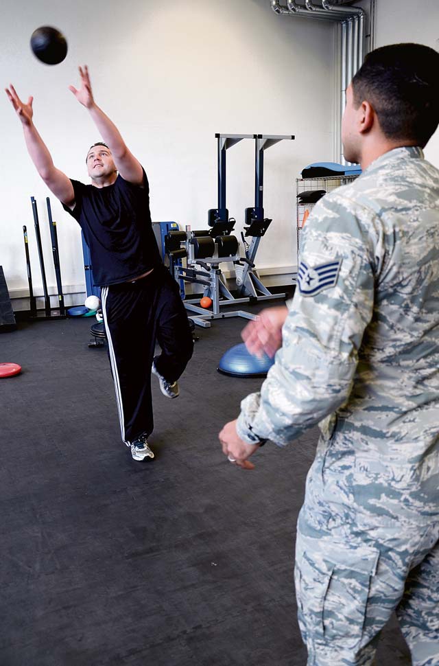 Photo by Senior Airman Timothy MooreSenior Airman James Harrod, 693rd Intelligence, Surveillance and Reconnaissance Group operations training manager, catches a weighted ball thrown by Staff Sgt. Mario Jimenez, 86th Medical Operations Squadron Physical Therapy technician, during a physical therapy session Aug. 19, 2014, on Ramstein. The 86th MDOS physical therapy clinic can see active-duty patients for a variety of neuromuscular injuries, such as sprains, strains, rehabilitation after the healing of a fracture and more. 