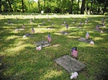 The Kindergraves are the final resting places for 451 American children of service members stationed in Europe during the buildup of the Cold War. The graves were decorated with American flags and roses before the ceremony.