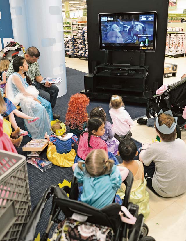 Children and parents watch a movie during the unveiling of the toy collection May 17 at the Ramstein Base Exchange. The unveiling included a “Who Am I?” character guessing game, a character meet ‘n’ greet, trivia and more.