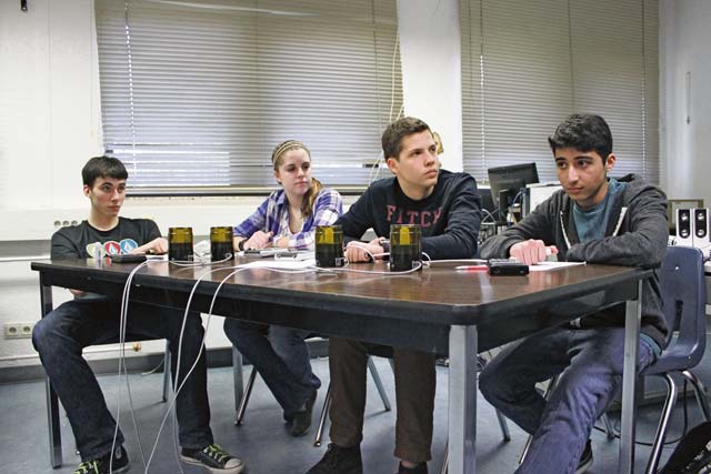 Photo by Holly FreemanRamstein High School students Randle Steinbeck, Kylie Weaver, Thomas Davey and Kevin Parvizi go head to head with the brain bowl team in a “Jeapordy” style questioning to help them prepare for an upcoming competition.