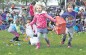Children stampede the field as they grab as many eggs as possible during the Ramstein Easter Egg Hunt and Kite Karnival. A few golden Easter eggs were scattered amongst the eggs, and prizes were given to the children who found them.