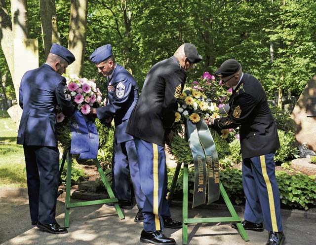 Air Force and Army personnel present wreaths in honor of their respective branches during the annual Kindergraves ceremony at the Kaiserslautern cemetery. 