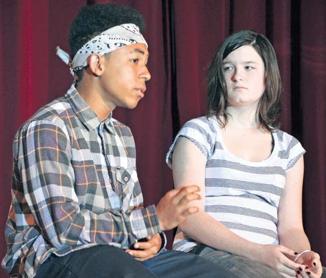 Photo by Elizabeth Behring“Chuck,” played by Daniel Estrada, tries to convince “Michelle,” played by Caitlin Akers, that an easy way to deal with difficult problems – instead of working them out by talking or other healthy ways – is to take drugs. The eighth-graders performed the play “Choices” Oct. 25 at Kaiserslautern Middle School on Vogelweh. The show, directed by drama, business and study skills teacher Iris Abbott and assisted by Adolescent Substance Abuse counselor Nick Seri, was the final event for the school’s anti-drug “Spirit Week,” which supported the Army’s Red Ribbon Week.