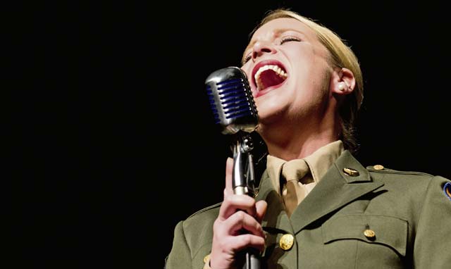 Staff Sgt. Jill Diem, regional vocalist for the U.S. Air Forces in Europe Band, sings during a Battle of the Bulge 70th anniversary commemoration event.