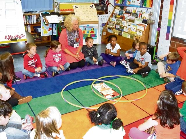 Courtesy photoLearning the basicsLandstuhl Elementary/Middle School teacher Melinda Stevens and her kindergartners learn  how to use graphs and charts, such as Venn diagrams, for sharing research.