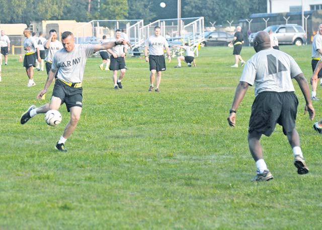 Lt. Col. Gary Farley, the 21st Theater Sustainment Command’s assistant chief of staff, G6, attempts to score a goal during a soccer game as part of a senior leader physical training session on Daenner Kaserne July 31.  Senior leaders, comprised of four teams, competed for the Millrinder Cup, and in the end, Team 4, captained by Chief Warrant Officer 4 James Britton, fought their way to victory.  