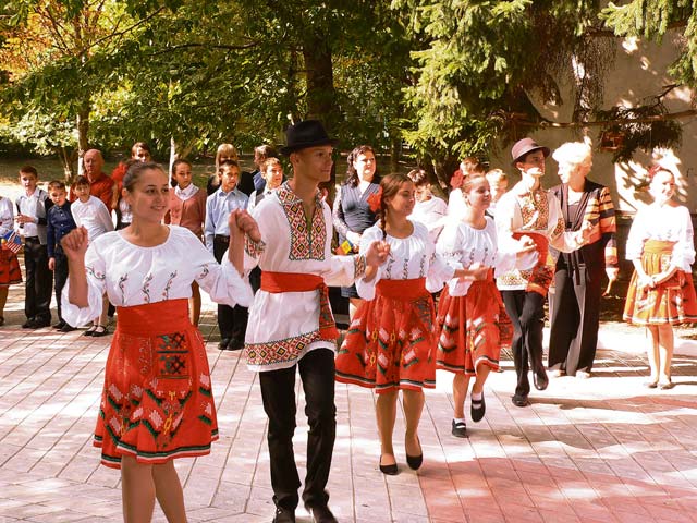Students from School 12 perform a traditional Moldovan dance during the ribbon cutting for the newly renovated school in Chisinau, Moldova. The students performed the dance as a show of gratitude to the 435th Air Ground Operations Wing’s Construction and Training Squadron, which sent Airmen to perform renovations on four restrooms, two locker rooms and two shower rooms in the school to make them functional and safe to use again.