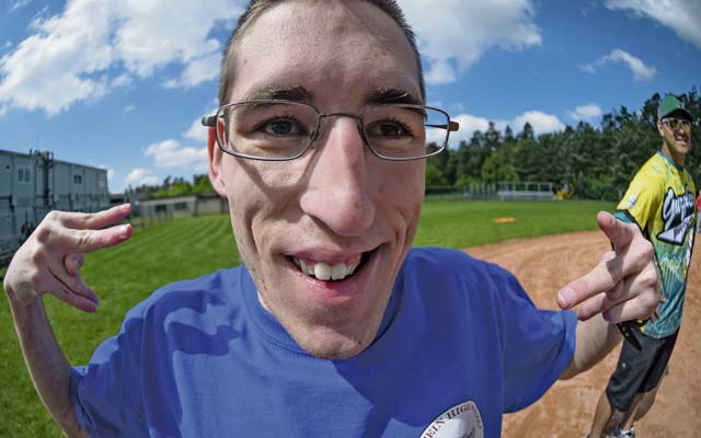 Ramstein High School softball player Josh Davis gets his photo taken while waiting on third base during an adaptive softball game on Ramstein. 