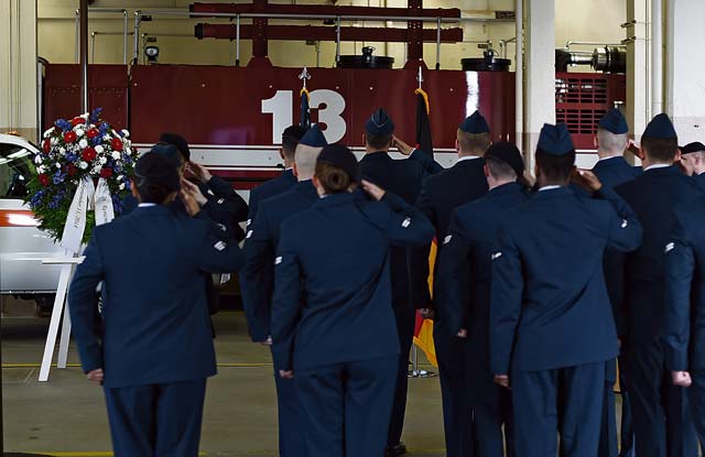 Photo by Senior Airman Damon KasbergMembers of Team Ramstein render a salute during a 9/11 ceremony Sept. 11, 2014, at Fire Station One on Ramstein. The ceremony was held to honor the first responders who lost their lives at the World Trade Center 13 years ago.