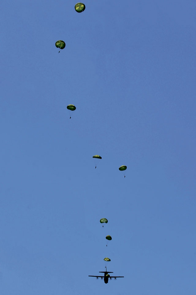 Bulgarian paratroopers perform a static-line jump from a C-130J Super Hercules during a flying training deployment July 15 in Plovdiv, Bulgaria. FTD Thracian Summer was a two-week training deployment for American and Bulgarian forces to work together and learn how each other perform their mission.