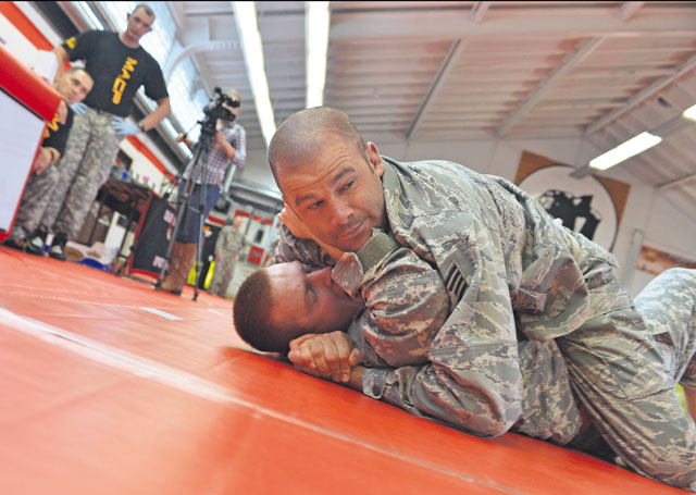 Tech. Sgt. Kevin Kline, 435th Construction and Training Squadron craftsman, attempts to gain position advantage during a combatives tournament Sept. 7 at the Kleber Fitness Center on Kleber Kaserne in Kaiserslautern. The competition was for all military members and tested the strength and skills of both male and female competitors. Trophies were awarded to 14 first- and second-place winners from different weight classes. Among the winners were four Airmen, two from Ramstein and the others from Kaiserslautern. The overall champion who claimed the ultimate prize of bragging rights  was Prince Brown from Baumholder, who went undefeated in all of his matches. 