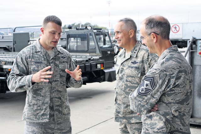 Photo by 1st Lt. Nicole MancosMaj. Gen. Frederick H.  Martin (center), U.S. Air Force Expeditionary Center commander, and EC Command Chief Master Sgt. Pete Stone (right) discuss the aerial port operations with Master Sgt. Justin Hemken, 721st Aerial Port Squadron NCO in charge of ramp services. The 721st APS provides passenger services for the 521st Air Mobility Operations Wing to expedite warfighting and humanitarian missions throughout Europe, the Middle East and Africa.