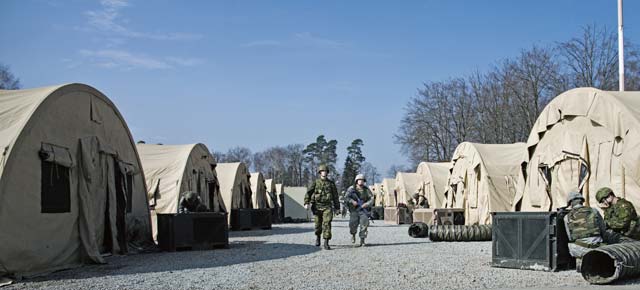 Photo by Senior Airman Jonathan StefankoU.S. Air Force and Royal Canadian Air Force Airmen patrol and build a base during Silver Flag March 8 on Ramstein. The objective of Silver Flag is to prepare Airmen not only for contingency response, but to build partnerships with allies from the bottom up.