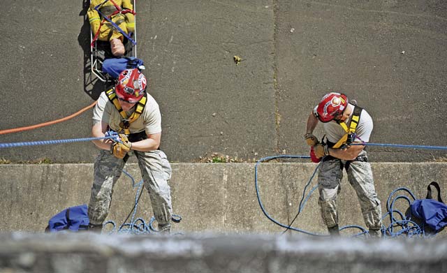 Airmen from the 435th Construction and Training Squadron show Lithuanian and Bosnian military members how to rescue a victim from a tall building during the Firefighters Fundamentals Course. With three squadrons, 45 separate Air Force Specialty Codes, 40 Building Partnership Capacity missions a year and being ready within a moment’s notice to forward deploy, the 435th Contingency Response Group has an uncommon mission in the Air Force.