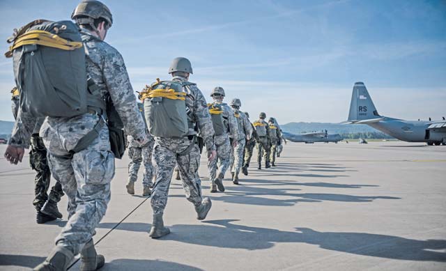 Parachutists from the U.S. and eight visiting countries prepare to board a C-130J Super Hercules May 5 on Ramstein. Approximately 300 jumpers from nine nations including the U.S. came together to celebrate International Jump Week by participating in several jump-related training scenarios.