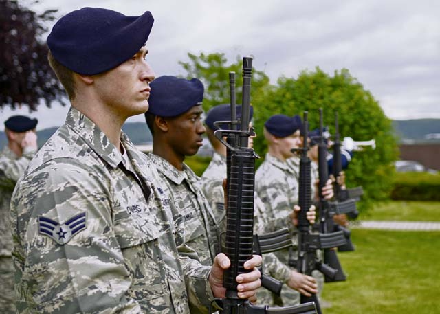 Senior Airman Andrew Owens, 86th Security Forces Squadron patrolman, holds a rifle during the playing of taps at a final guard mount ceremony May 15 on Ramstein. The final guard mount ceremony was held on national Peace Officers Memorial Day to pay tribute to fallen defenders.