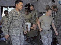 Members of the 86th Medical Group tactical critical care evacuation team-enhanced and the 160th Forward Surgical team carry a training dummy to a simulated medical evacuation zone during joint FST training July 18 on Ramstein. Members of the 86th MDG TCCET-E and the 160th FST trained together to increase their interoperability.