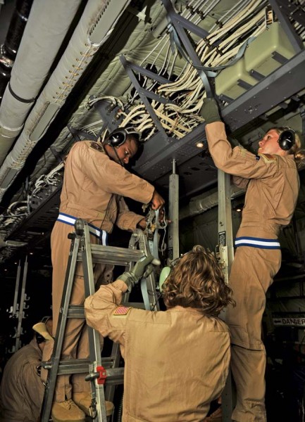 Photo by Senior Airman Hailey Haux Airmen from the 86th Aeromedical Evacuation Squadron convert a C-130J Super Hercules into a flying critical care unit, July 26, 2014. There were enough medical supplies and equipment necessary to perform surgery in the aircraft.