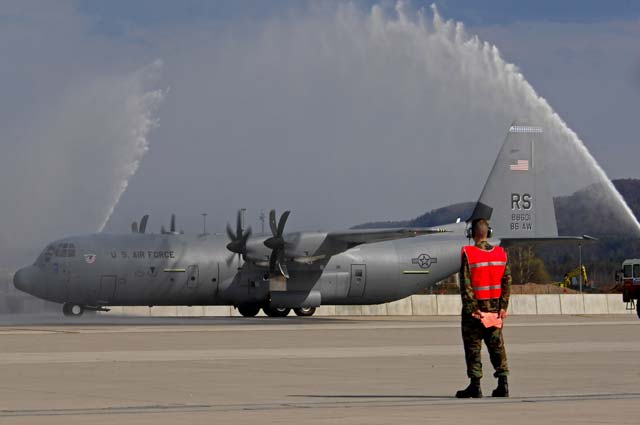 Photo by Airman 1st Class Kenny HolstonThe first U.S. Air Force C-130J to be assigned to the Ramstein Air Base fleet taxies under pressured water from two Ramstein fire trucks during a celebration ceremony April 7, 2009. The J-model landed on Ramstein for the first time during a ceremony held to not only honor the arrival of the new aircraft but also a new era in operations for the 86th Airlift Wing. 