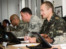 Ukrainian army Senior Praporshchik (chief master sergeant equivalent) Roman Kuzmenko (right), Ukrainian Armed Forces General Staff, listens 
to a discussion during a class at the Kisling NCO Academy Aug. 29 on Ramstein. Kuzmenko is part of a Department of Defense initiative 
designed to improve the NCOs of partner countries.
