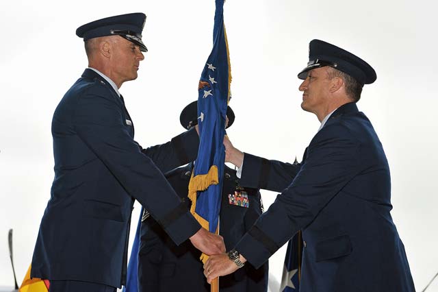Photo by Airman 1st Class Dymekre Allen Brig. Gen. Patrick X. Mordente (right), 86th Airlift Wing commander, takes the 86th AW guidon from Lt. Gen. Craig A. Franklin, 3rd Air Force commander,  during a change of command ceremony Monday on Ramstein. Mordente assumed command of the largest wing in Europe from Brig. Gen. C.K. Hyde.