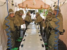 Photo by Airman 1st Class Dymekre AllenAirmen from the 86th Medical Group process a simulated chemical decontamination checkpoint station during training Monday on Ramstein. The medical group conducts training on base to test the group’s readiness.