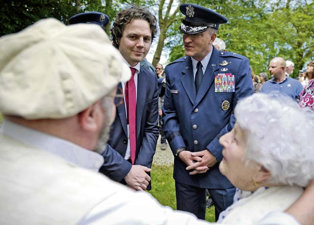 Photo by Staff Sgt. Sara KellerU.S. Air Force Brig. Gen. Patrick X. Mordente, 86th Airlift Wing commander, speaks with Odette Lonckheere and her son Patrick, Coigny residents, June 7 at Franquetot Castle. Odette shared her story of how she chose to join the French army alongside her husband during World War II.