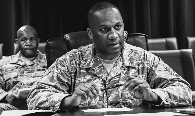 Courtesy photoTech. Sgt. Kevin Brown, 86th Aircraft Maintenance Squadron resource adviser and former president of the Kaiserslautern African-American Heritage Committee, reviews the monthly agenda. Brown was selected for the National Association for the Advancement of Colored People Roy Wilkins Renown Service Award for his community service.