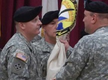 Maj. Gen. John F. Wharton (right), U.S. Army Sustainment Command commanding general, passes the 405th Army Field Support Brigade colors to Col. Todd S. Bertulis, 405th AFSB commander, at a change of command ceremony Aug. 7 on Daenner Kaserne in Kaiserslautern.