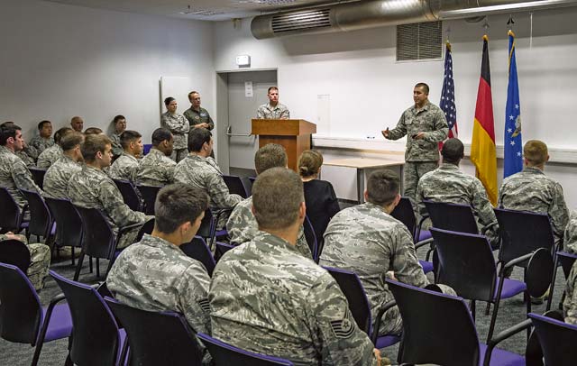 Airman 1st Class Christopher Torres, 86th Aircraft Maintenance Squadron dedicated crew chief, delivers a speech to shopmates after releasing a C-130J Super Hercules with a black letter designation Oct. 7 on Ramstein. A black letter designation indicates that an aircraft is operating under ideal circumstances and has no outstanding mechanical issues or due inspections.