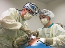 Maj. Curtis Hayes (left), 86th Dental Squadron chief oral and maxillofacial surgeon, and Senior Airman Britanni McKnight, 
86th DS dental assistant, operate on a patient during a dental implant surgery April 29 on Ramstein.