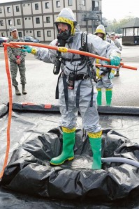 Airman 1st Class Eric Roberts, 86th Aerospace Medical Squadron bioenvironmental engineer journeyman, goes through decontamination after leaving a crime scene during a biological response exercise.