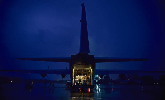 Photo by Staff Sgt. Sara KellerStaff Sgt. Cassandra Hancock, 37th Airlift Squadron loadmaster, prepares cargo on the ramp of a C-130J Super Hercules Oct. 7, 2014, on Ramstein prior to a mission in response to the Ebola virus epidemic in West Africa. This was the first C-130J Super Hercules flight launched in support of Operation United Assistance.