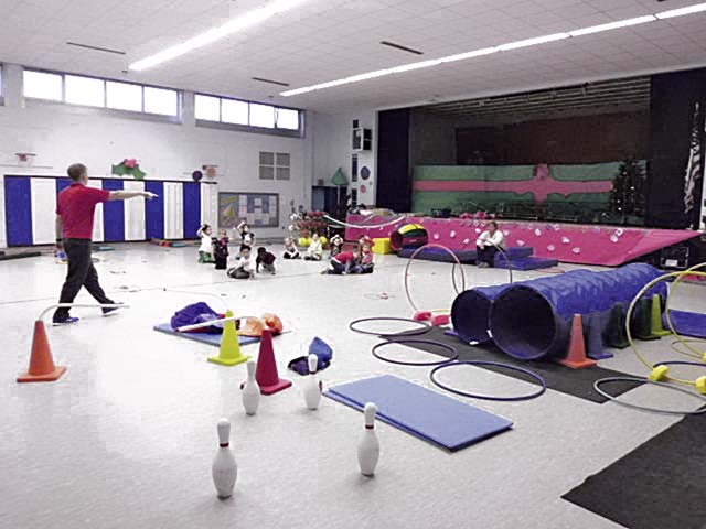 Courtesy photoObstacle courses at WESKyle Holland, a physical education teacher at Wetzel Elementary School and Smith  Elementary School in Baumholder, sets up an obstacle course for kindergartners to  maneuver.