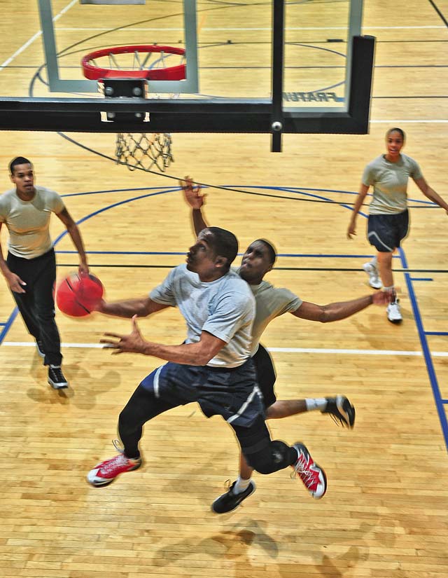 Detrus Graham Jr. swiftly lays up the basketball underneath the hoop.